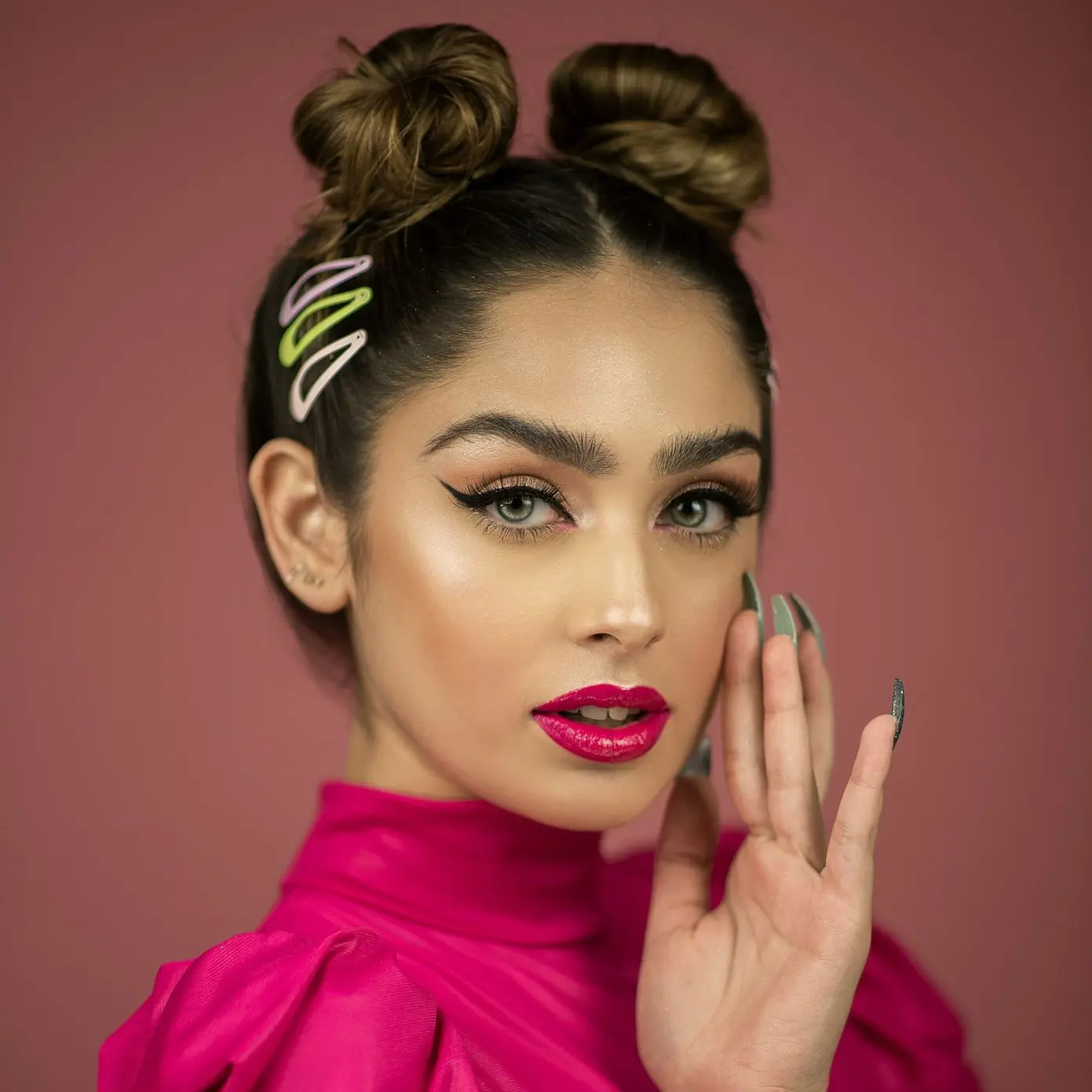 woman in pink turtleneck long-sleeved near wall